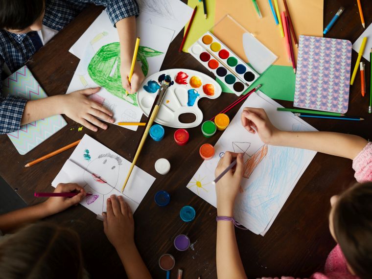 group of children drawing, crafting, painting