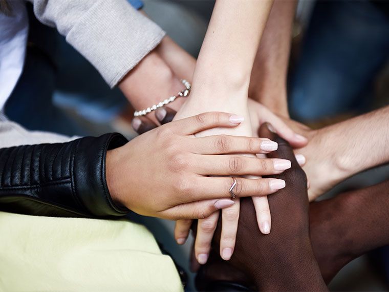 people holding hands together