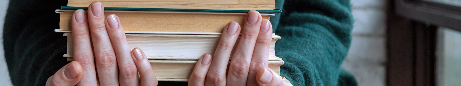 person holding books