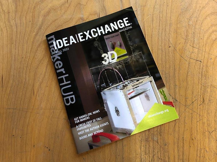 Idea Exchange fall magazine on wood desk.