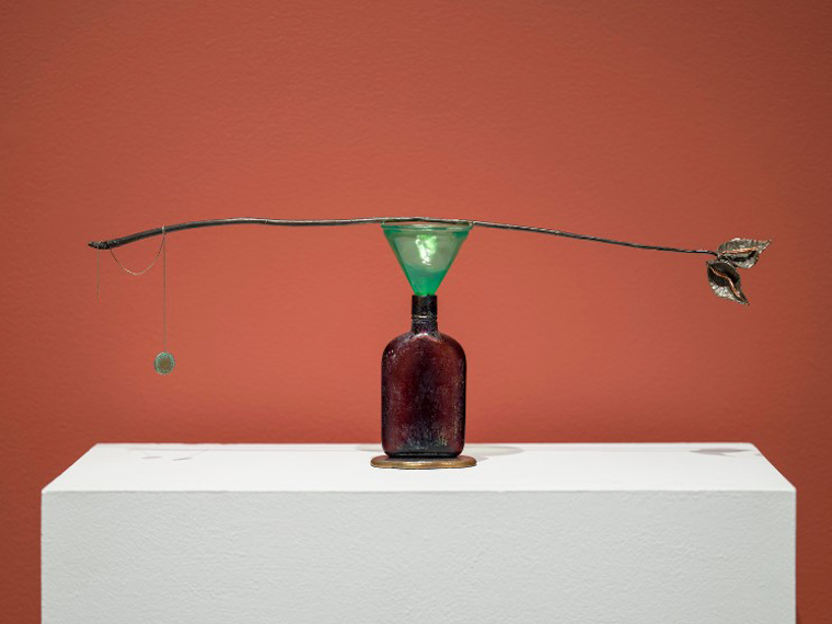 Meera Margaret Singh,Holding (5), sculpture made of bronze, found object (glass bottle), glass, silver chain. Installation at Gallery TPW, 2024. Photo by Darren Riggo. Image courtesy of artist.