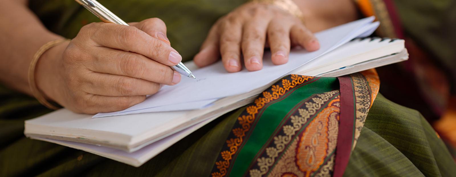 Person writing in a journal or notebook
