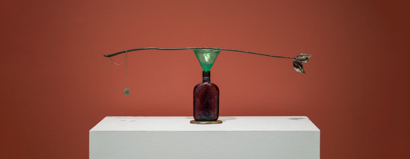 Meera Margaret Singh,Holding (5), sculpture made of bronze, found object (glass bottle), glass, silver chain. Installation at Gallery TPW, 2024. Photo by Darren Riggo. Image courtesy of artist.