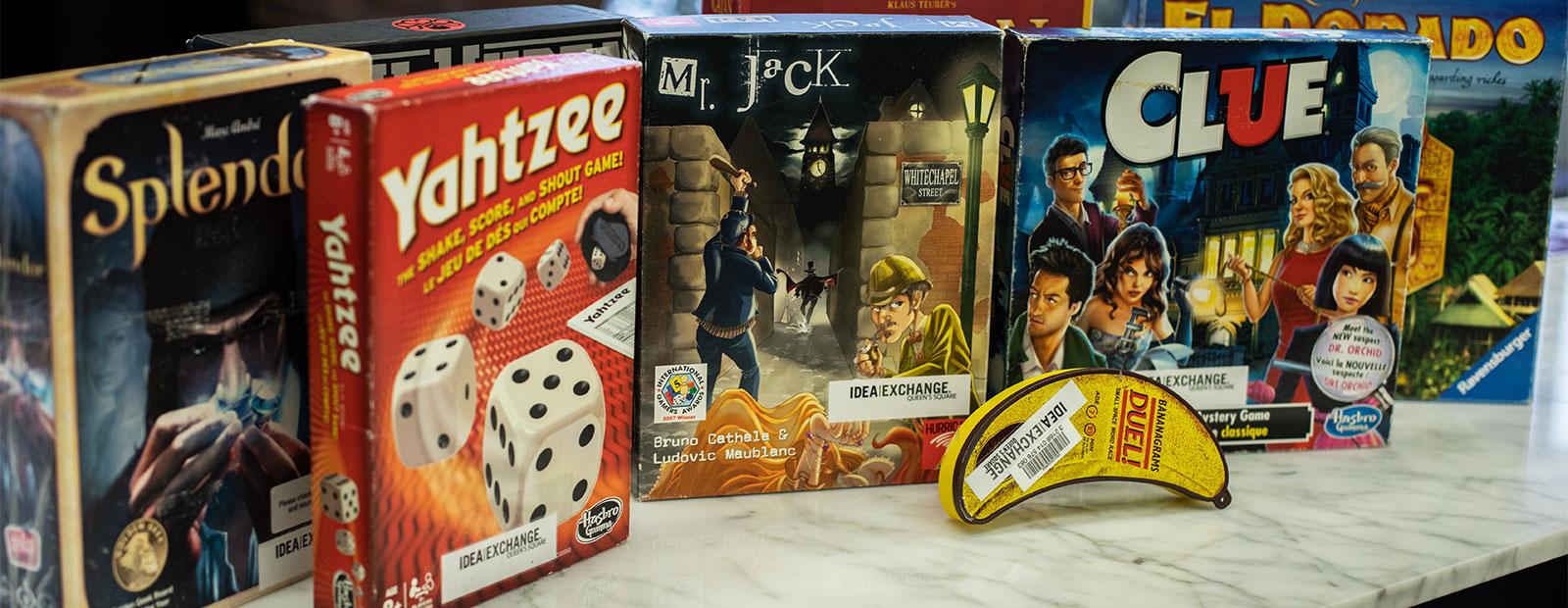 Selection of board games sitting on a table.