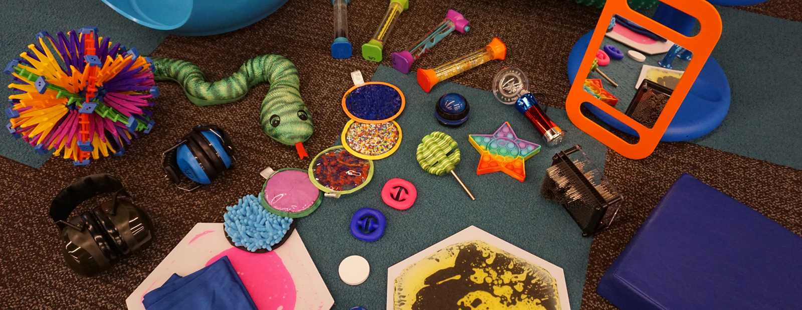 Items from the sensory collection such as colourful toys and stuff animals