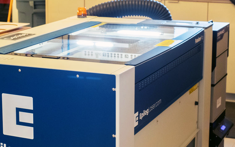 An Epilog laser cutter machine.