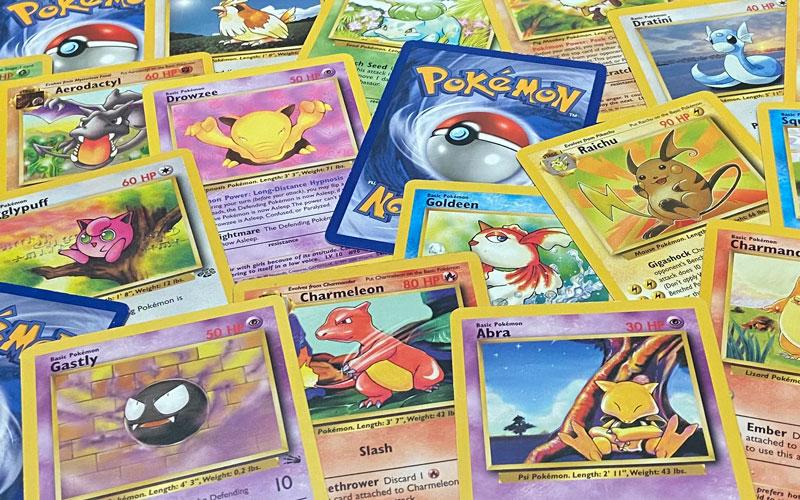 A collection of various Pokémon trading cards.